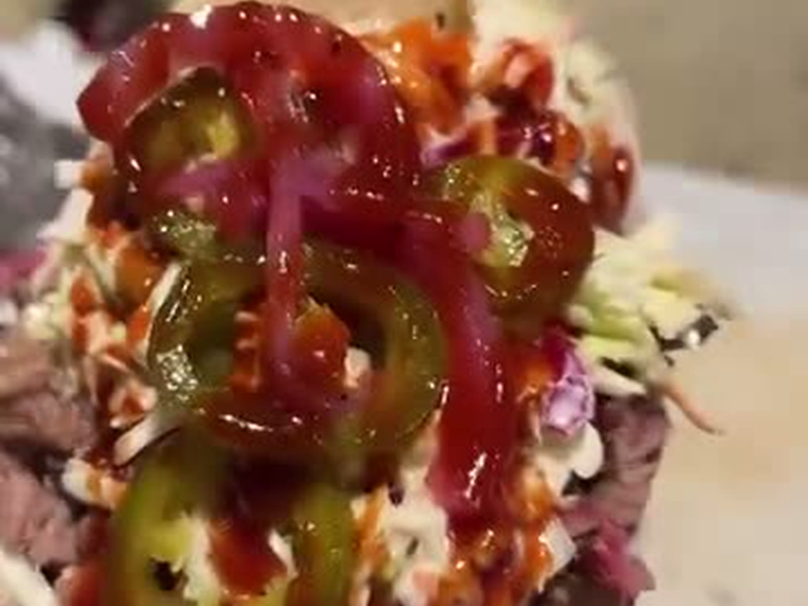 Chopped brisket sandwich with Memphis slaw and pickled jalapeños